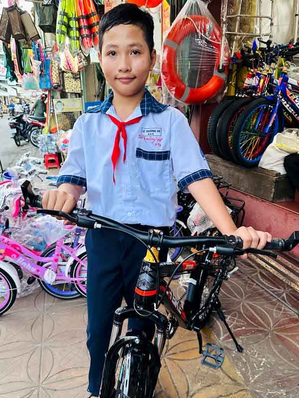 Vu with his new bicycle.